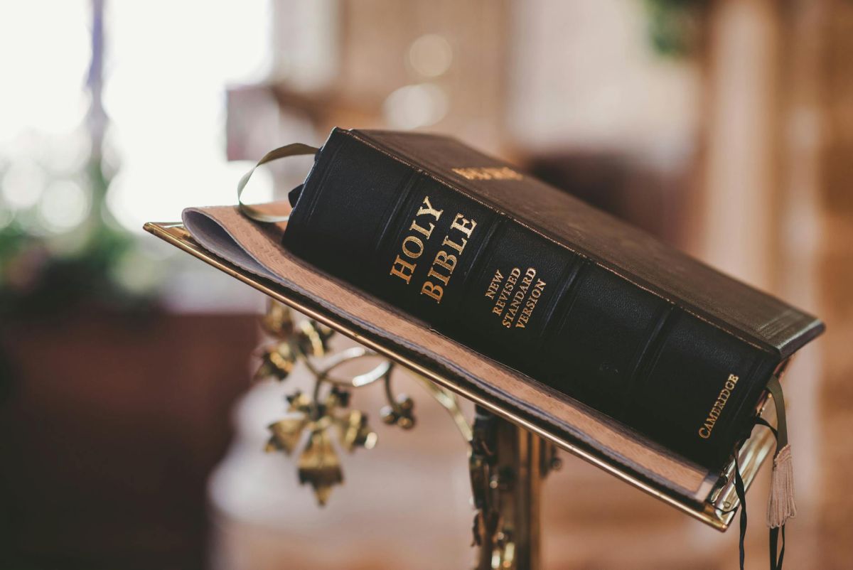 An open Bible on a lectern